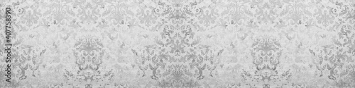 Old gray white rusty vintage shabby damask patchwork tiles stone concrete cement wall texture background banner panorama
