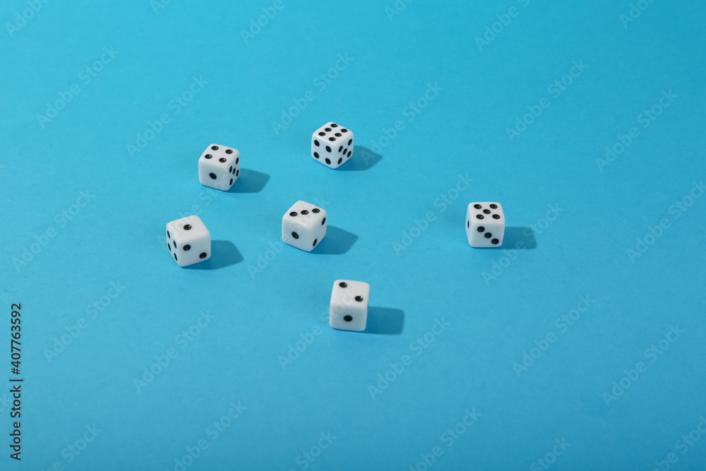 dice on blue background top view with copy space. dice on blue background top view with copy space.