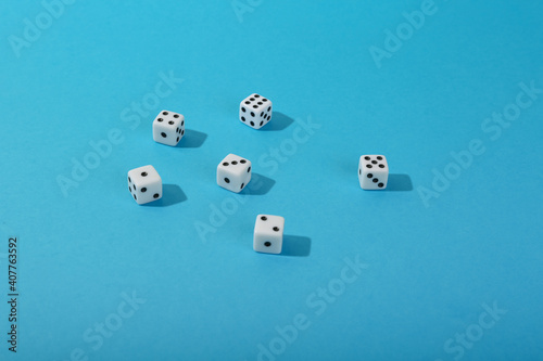 dice on blue background top view with copy space. 