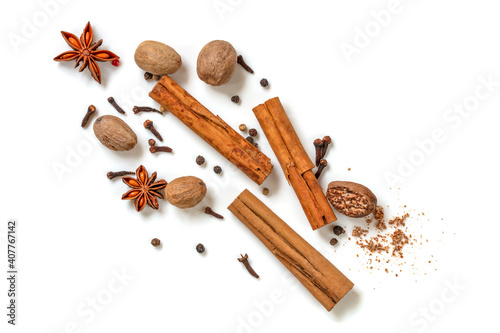 Fototapeta Naklejka Na Ścianę i Meble -  Cinnamon Sticks Nutmeg Star Anise Cloves Peppercorns over White Top View