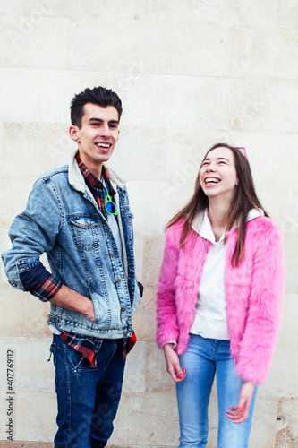 young pretty couple of student boy and girl together outside happy smiling, lifestyle people concept