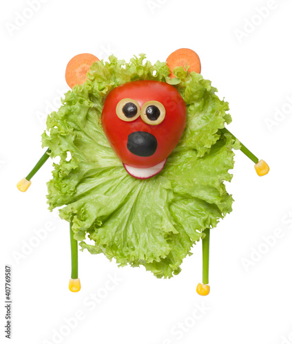 Funny vegetable bear made of salad, tomato, cucumber, carrot. Fun food for kids. Creative cooking idea. Isolated on white background.