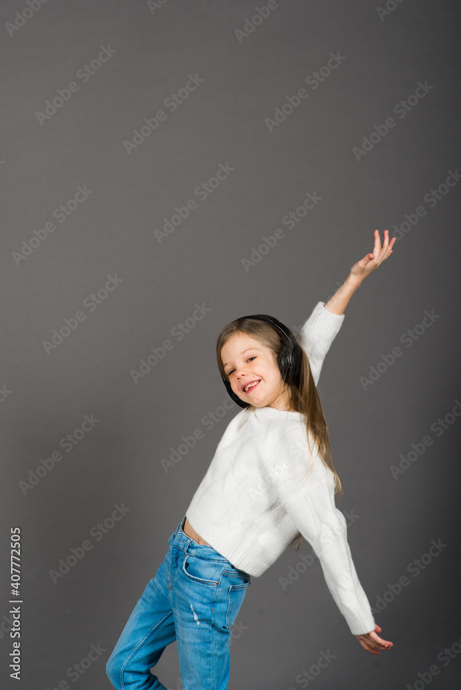 Portrait of a beautiful, joyful and confident girl isolated on grey Portrait of a beautiful, joyful and confident girl isolated on grey