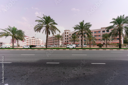 crossroads, a block with beautiful low-rise buildings and palm trees © Alexandr