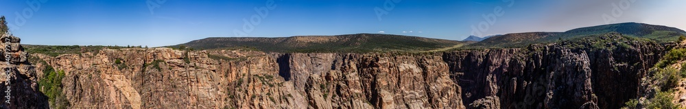 Panorama shot of edge of rocky walls in black canyon of gunnison at sunny day in america Panorama shot of edge of rocky walls in black canyon of gunnison at sunny day in america