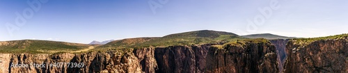 Panorama shot of edge of rocky walls in black canyon of gunnison at sunny day in america