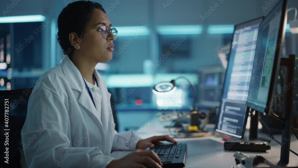 Modern Electronics Development Facility: Female Engineer Works on Computer with CAD Programming Software. Scientists Design of Industrial PCB, New Generation Silicon Microchips, Semiconductors