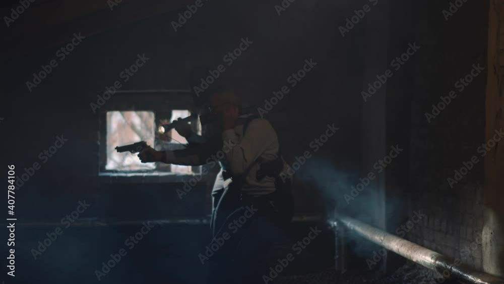 Diverse policemen with flashlight and gun chasing criminal in dark attic. Diverse policemen with flashlight and gun chasing criminal in dark attic.