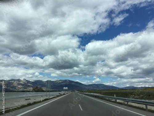 driving on the highway with clouds © mirebel