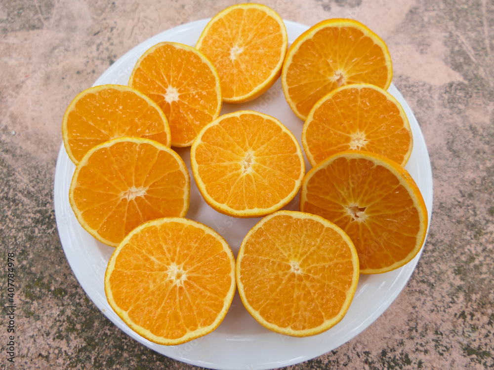 Clementines Cut In Half On A Plate Clementines Cut In Half On A Plate