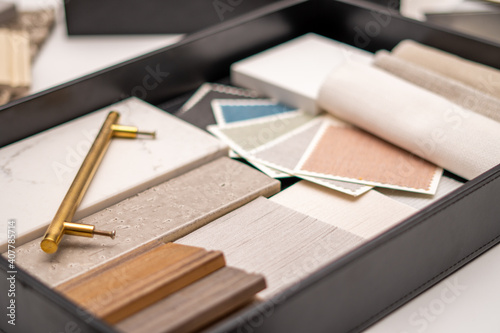 Obraz na płótnie Interior designer's working table, an architectural plan of the house, a color palette, furniture and fabric samples. Drawings and plans for house decoration. w salonie