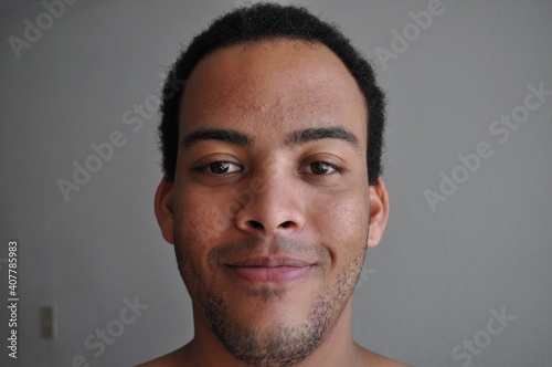 Mixed Race man stubbled face expression content