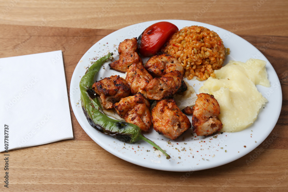 Chicken shish kebab with bulgur pilaf and mashed potato Chicken shish kebab with bulgur pilaf and mashed potato