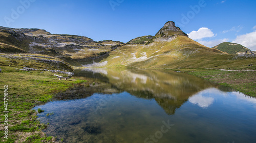 Mountain lake Augstsee just below the Loser mountain in Austria photo