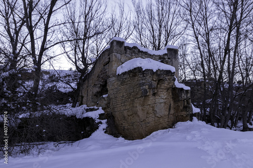 Abandoned mill captured on a snowy day in Guadalaviar Nature Trail, Spain photo