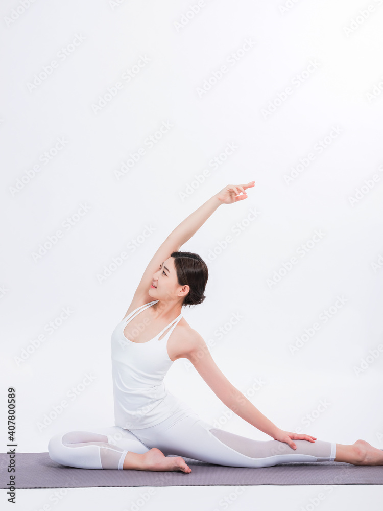 Young women practice yoga
