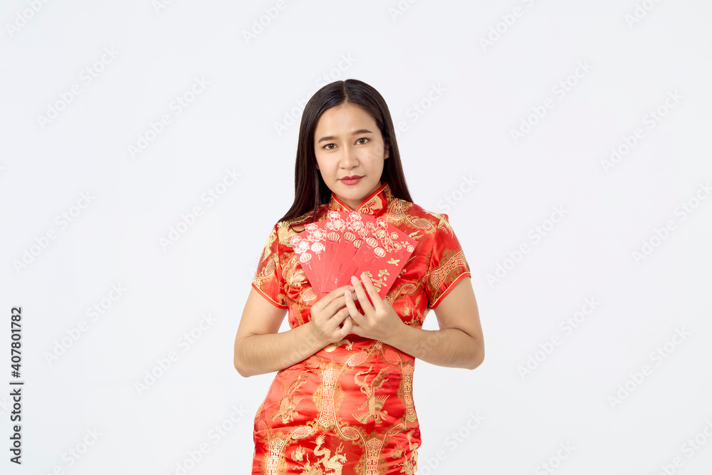 Asian woman in traditional red cheongsam dress Asian woman in traditional red cheongsam dress