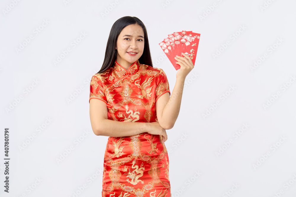 Asian woman in traditional red cheongsam dress Asian woman in traditional red cheongsam dress