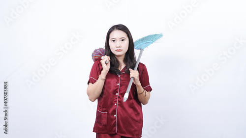 woman wearing pajama hold sulak and broom isolated white background
