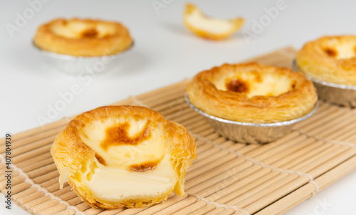 Baked egg tart on white background