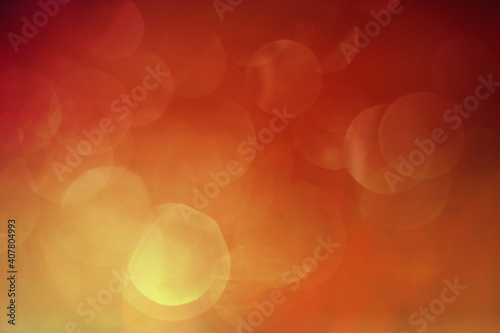 Abstract of red-orange bokeh lights background - perfect as wallpaper or background photo