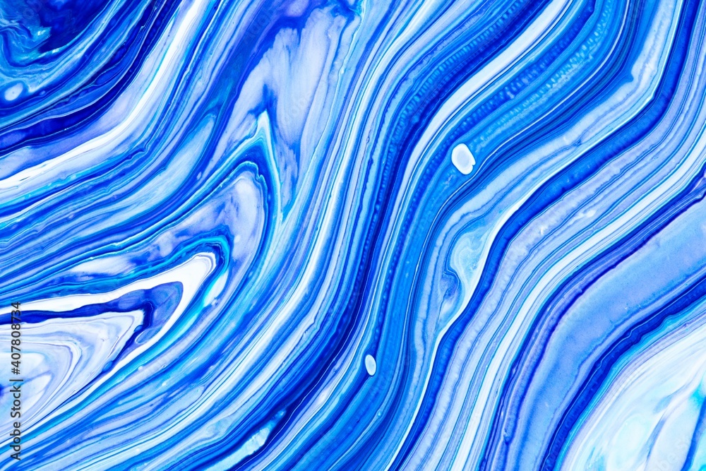 Fluid art texture. Abstract backdrop with mixing paint effect. Liquid acrylic picture with flows and splashes. Mixed paints for posters or wallpapers. Blue, navy blue and white overflowing colors Fluid art texture. Abstract backdrop with mixing paint effect. Liquid acrylic picture with flows and splashes. Mixed paints for posters or wallpapers. Blue, navy blue and white overflowing colors