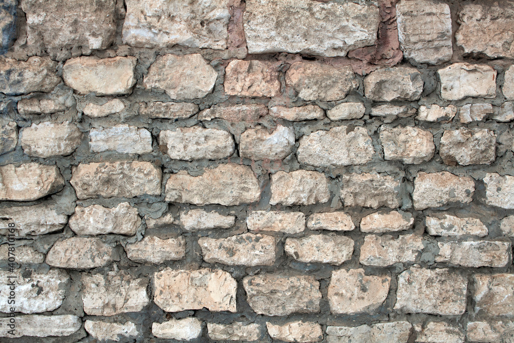 Fototapeta premium decorative uneven cracked stone wall surface