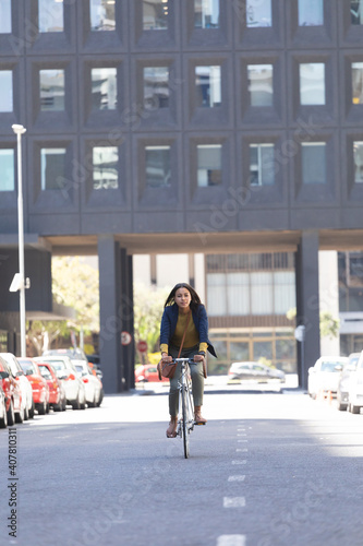 Wallpaper Mural African american woman riding bicycle on the street Torontodigital.ca