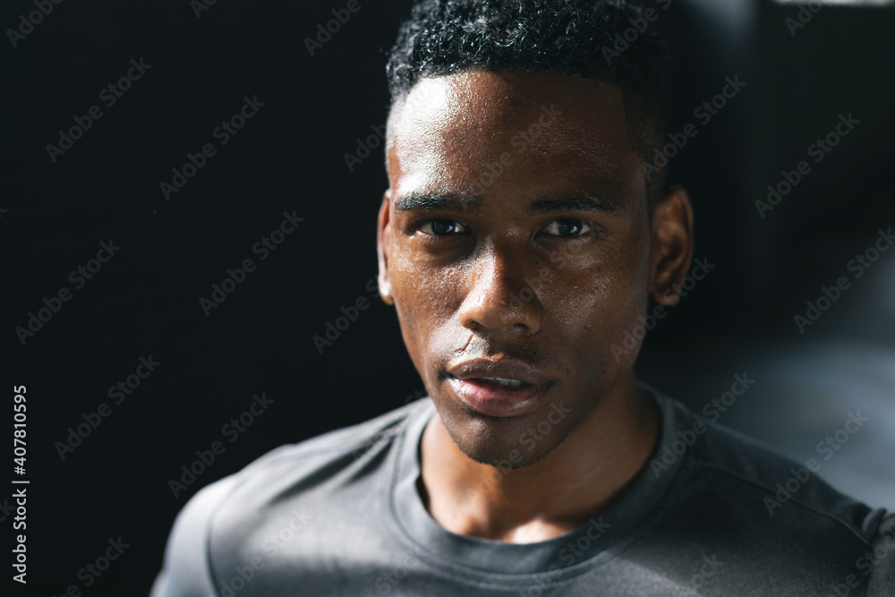 Portrait of african american man standing in an empty urban building looking at camera Portrait of african american man standing in an empty urban building looking at camera