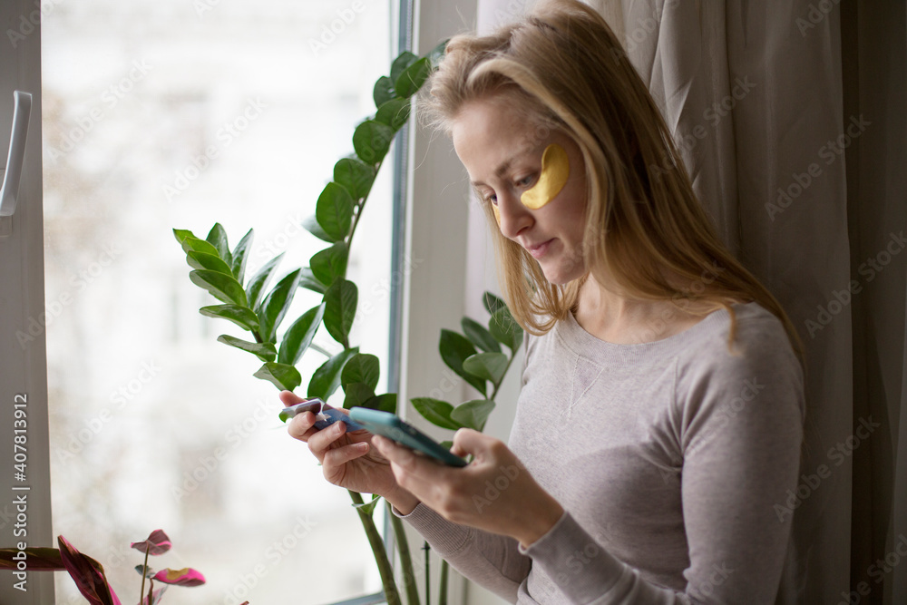 The girl makes purchases over the Internet without leaving their home. Payment for services by means of mobile banking.
