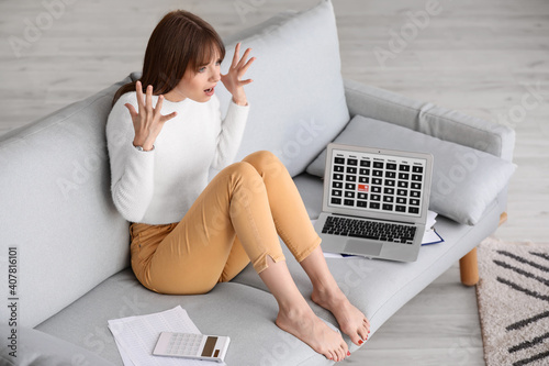Stressed young woman trying...