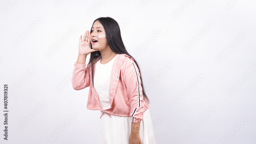 Portrait of young Asian woman shouting and yelling Portrait of young Asian woman shouting and yelling