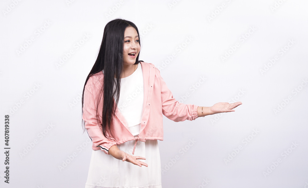 asian woman pointing left blank space isolated white background asian woman pointing left blank space isolated white background