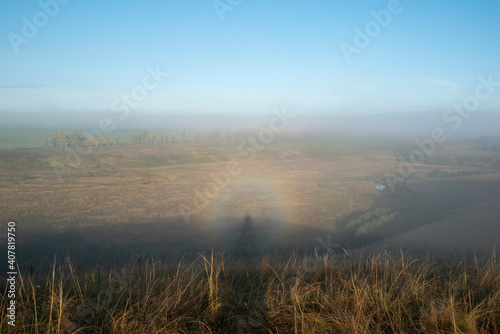 Rare optical phenomenon Gloria on a foggy morning. Rainbow