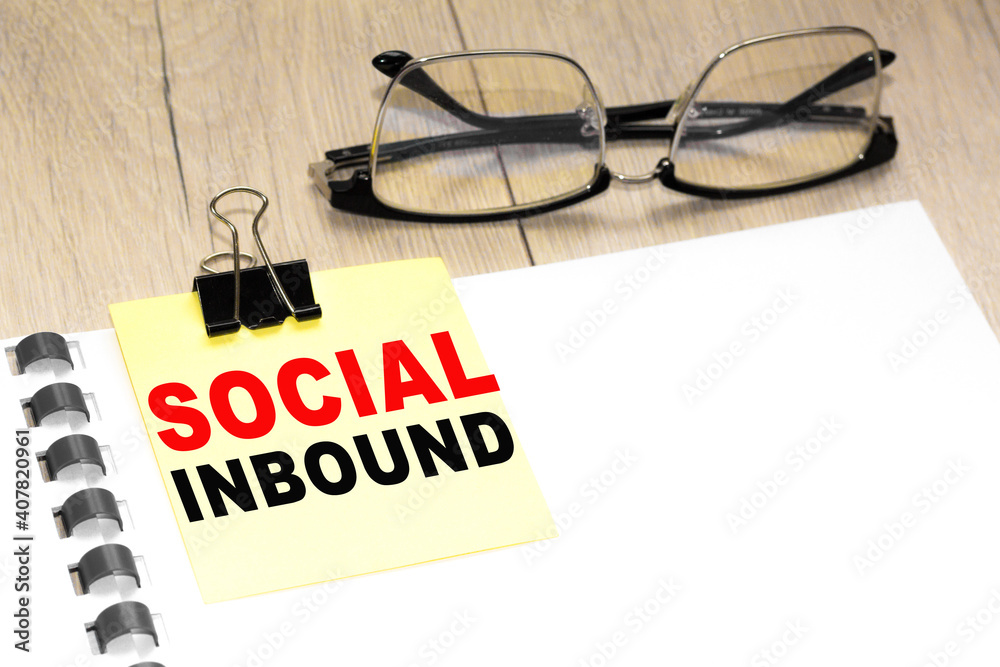Text SOCIAL INBOUND on a notepad with eyeglasses and text documents. Could be for business, financial and marketing concepts Text SOCIAL INBOUND on a notepad with eyeglasses and text documents. Could be for business, financial and marketing concepts