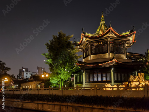 Illuminated pagoda in an Asian historical ancient style park  night shot 