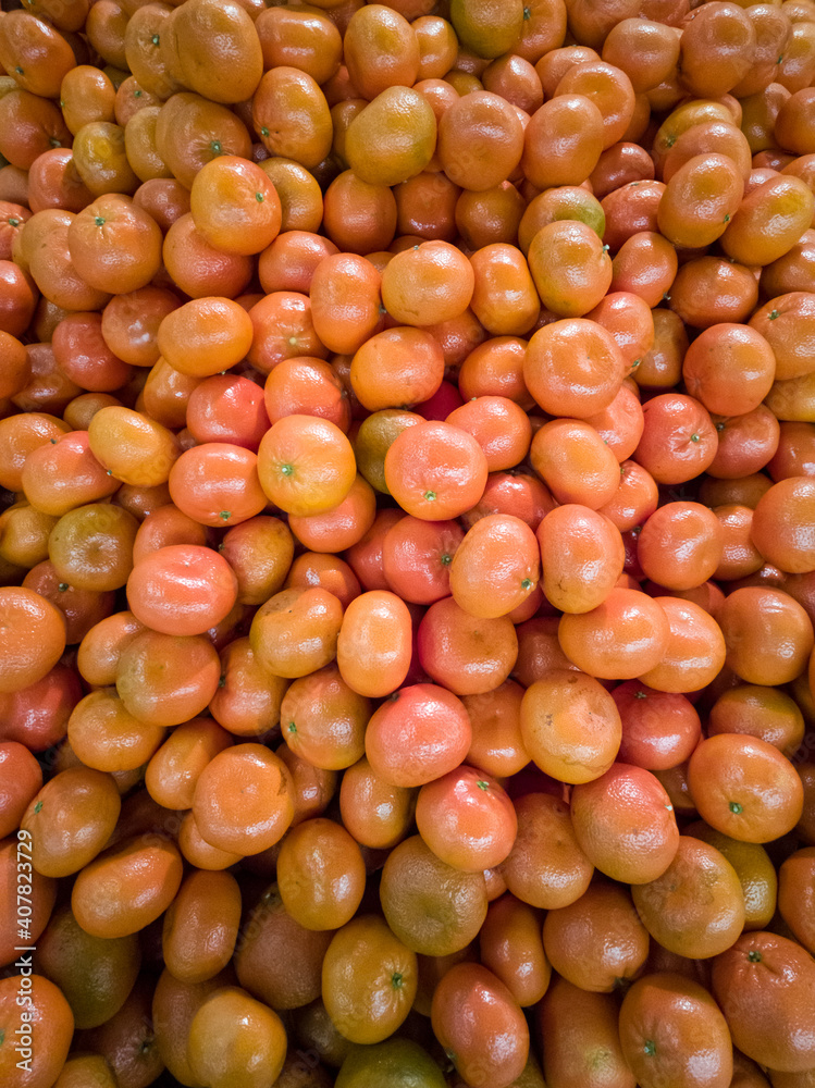 Bright orange tangerines a bunch of fruity background Bright orange tangerines a bunch of fruity background