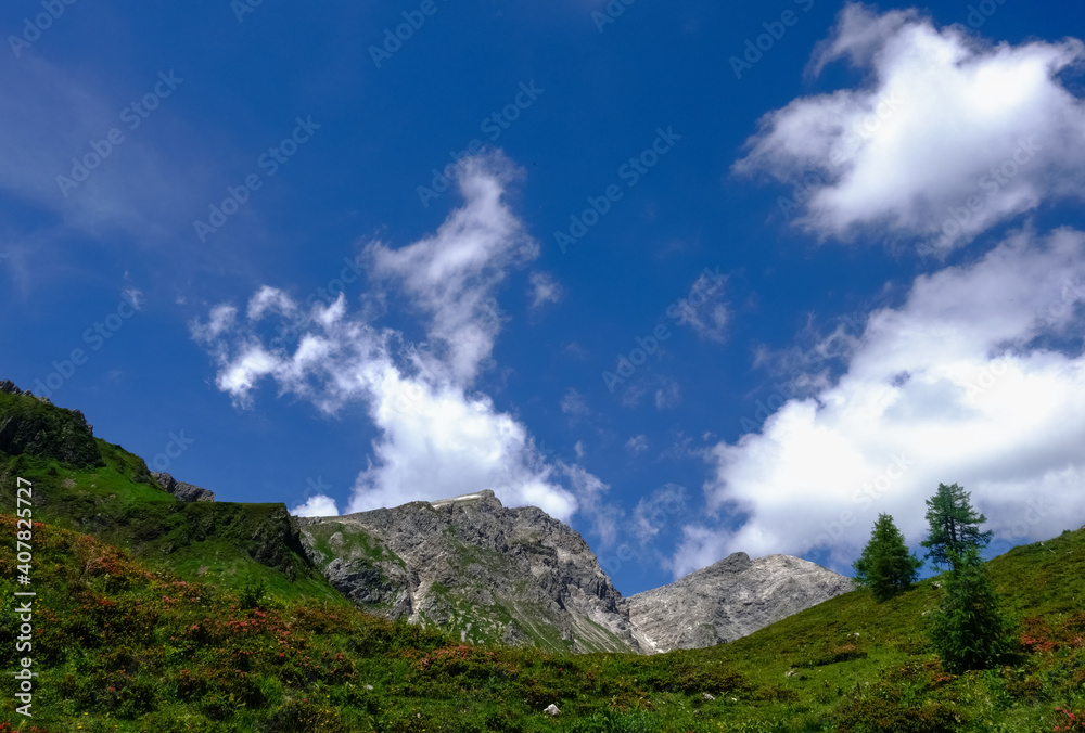 green mountains landscape with white clouds on the sky