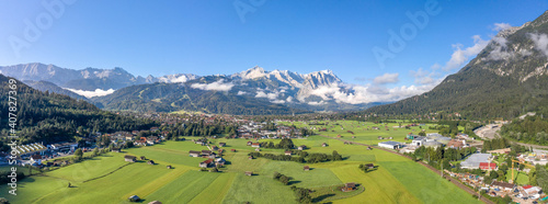 Aerial panorama view of Garmisch Partenkirchen Village with view of Zugspitze in fog