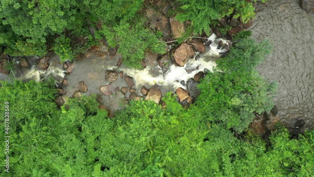 Aerial view of amazing waterfalls in nature in tropical forest, rainy season at public and famous place in Trat Province of Thailand. Aerial view of amazing waterfalls in nature in tropical forest, rainy season at public and famous place in Trat Province of Thailand.