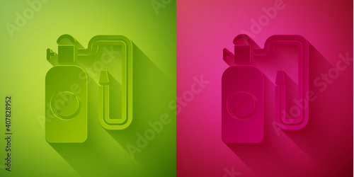 Paper cut Pressure sprayer for extermination of insects icon isolated on green and pink background. Pest control service. Disinfectant sprayer. Paper art style. Vector.