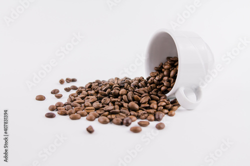 white cup of coffee with sprinkled coffee beans