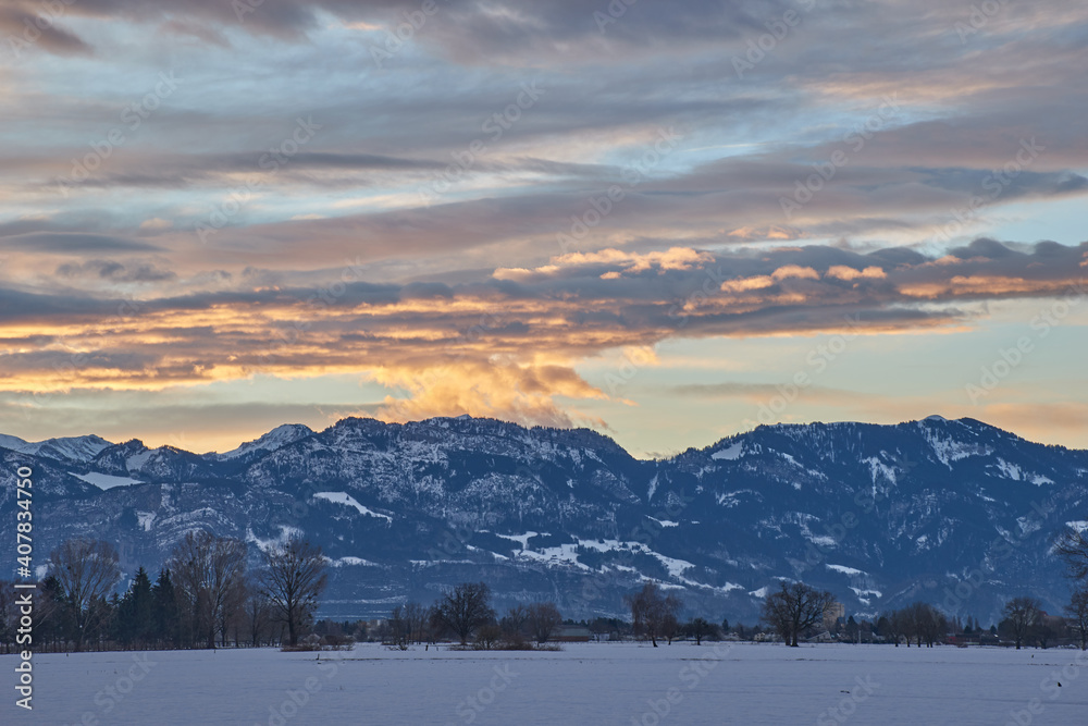 Sunrise over snowy mountain landscape Sunrise over snowy mountain landscape