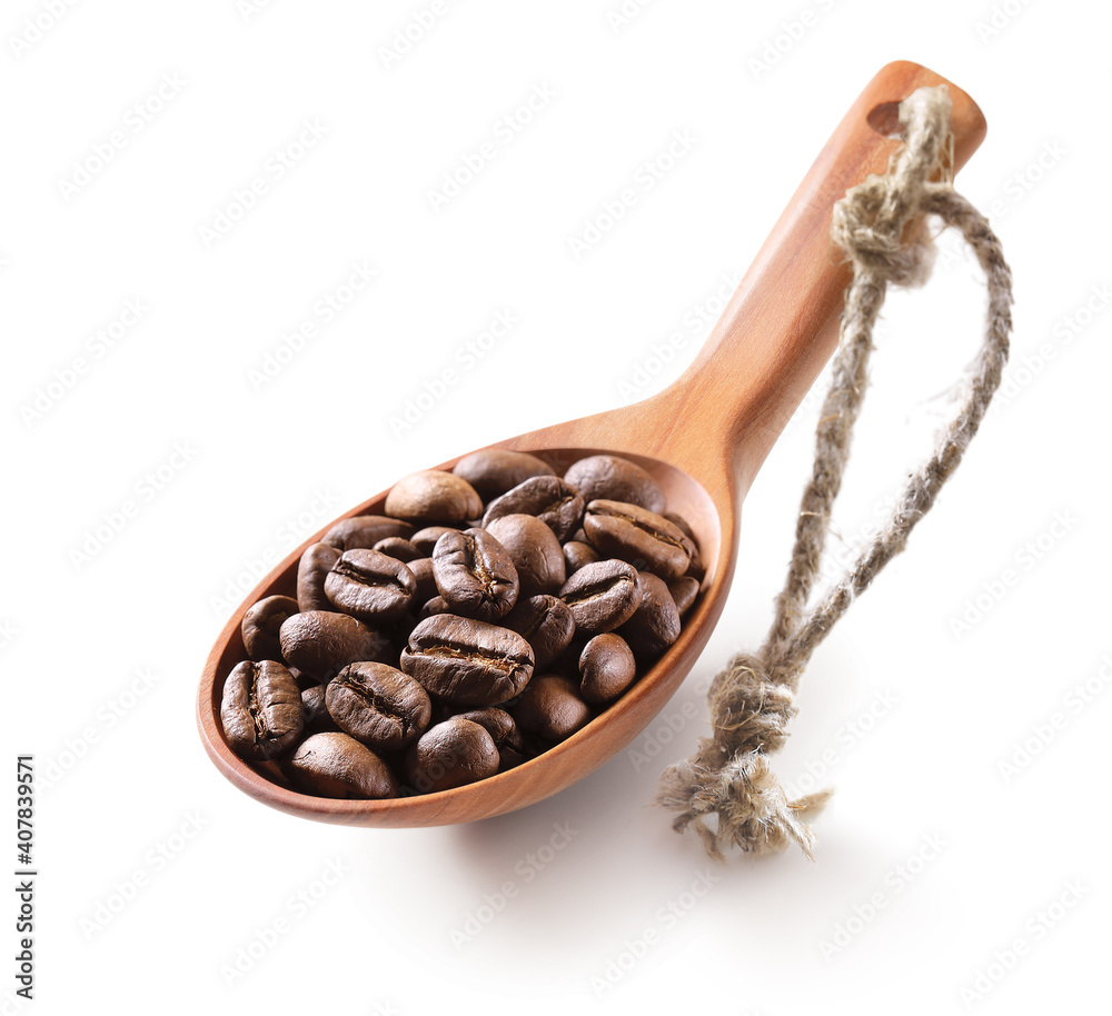 Fototapeta premium Coffee beans in a wooden spoon isolated on white background