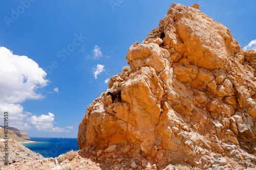Beautiful road to Balos. Goats on a rock photo