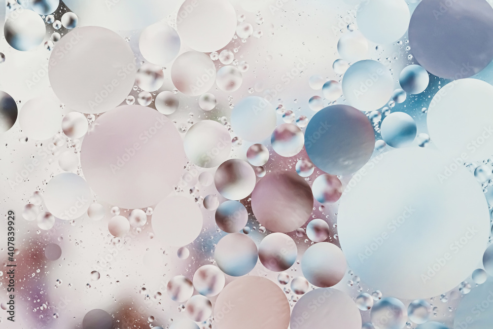 Pink and blue light tones oil with water round different sizes bubbles in vintage effect macro Pink and blue light tones oil with water round different sizes bubbles in vintage effect macro