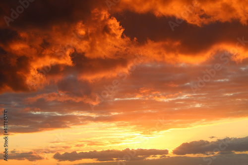 Fototapeta Naklejka Na Ścianę i Meble -  Colorful sunset sky background with orange clouds in twilight time
