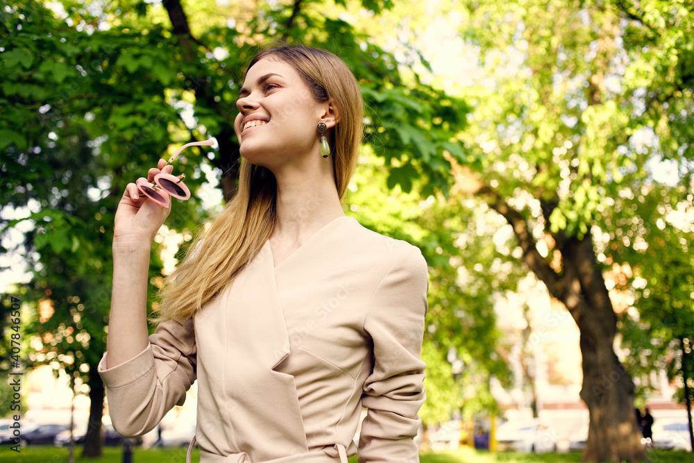 Pretty woman outdoors in green trees park rest Pretty woman outdoors in green trees park rest