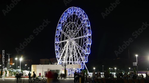 Ferris wheel in the night city. Seamless loop time lapse in high definition 4k Ultra HD 3840 x 2160, 30 FPS with copy space. photo