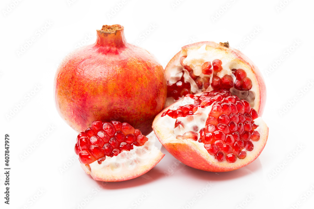 Ripe red pomegranate isolated on a white background Ripe red pomegranate isolated on a white background